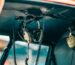 Close-up of aviation headsets hanging in an airplane cockpit, showcasing cockpit technology.